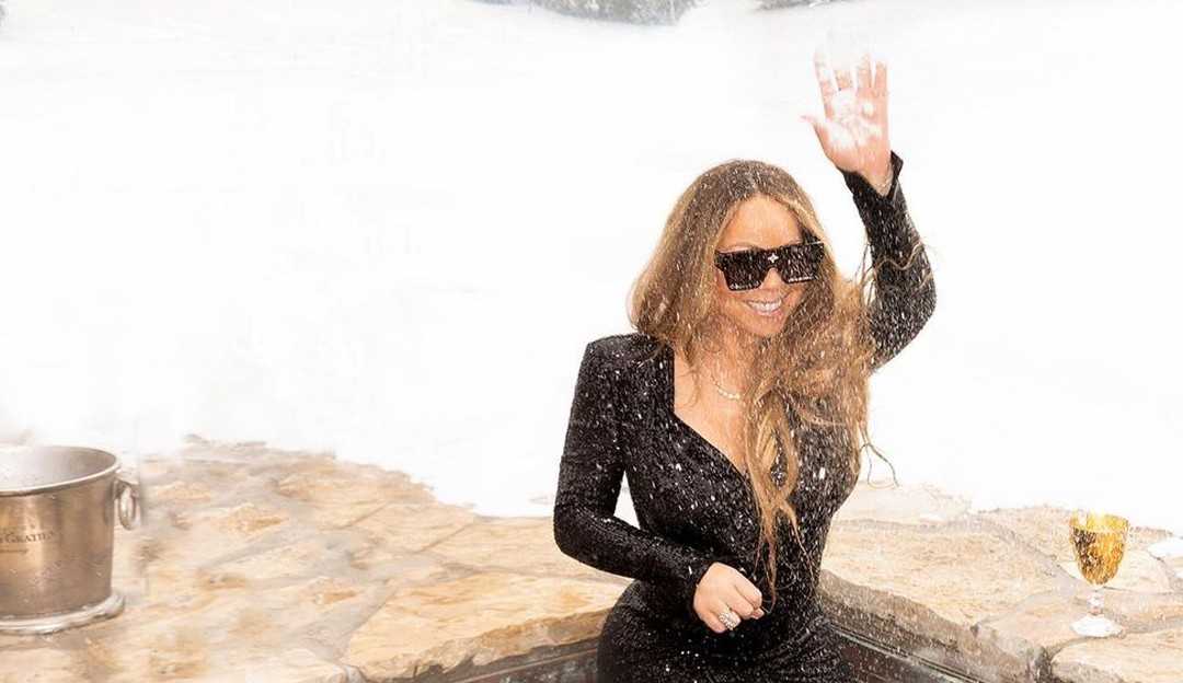 Mariah Carey surpreende fãs com clique em piscina usando vestido brilhante e óculos de R$5,5 mil, na neve