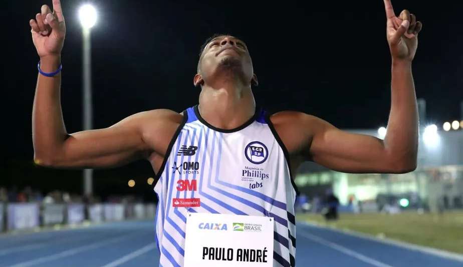Paulo André vence Troféu Brasil de Atletismo e comemora com seu filho
